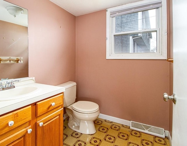 bathroom with toilet and vanity