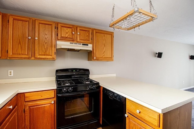 kitchen featuring kitchen peninsula and black appliances