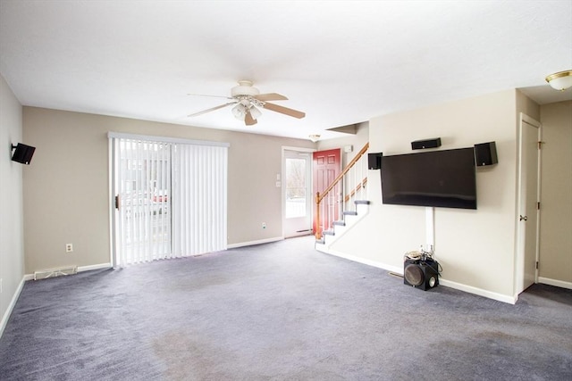 unfurnished living room featuring ceiling fan and carpet flooring