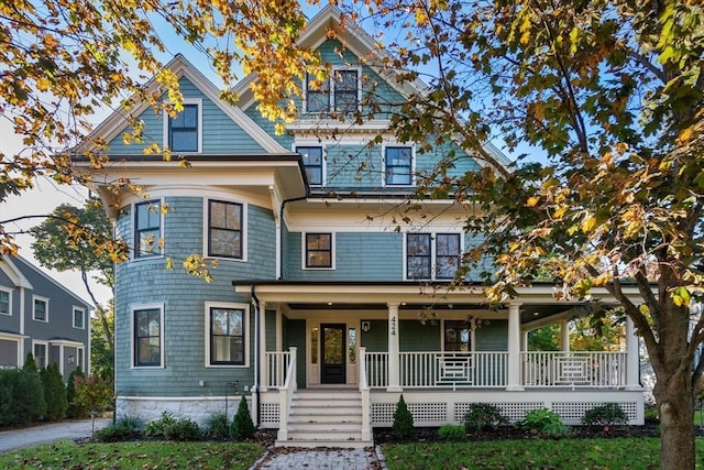 victorian-style house featuring a porch