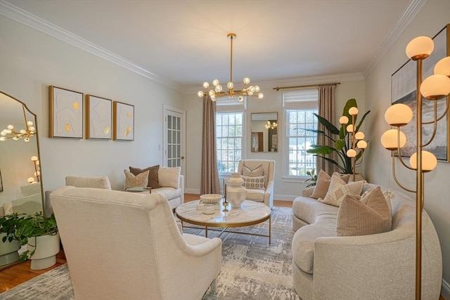 living room featuring an inviting chandelier, wood-type flooring, and crown molding