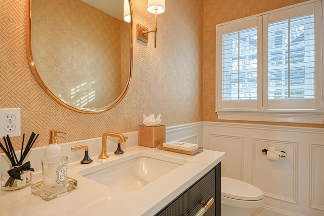 bathroom with vanity and toilet