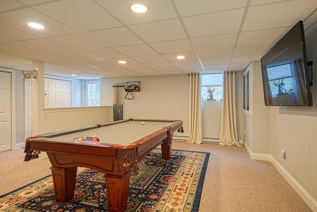 rec room featuring a paneled ceiling and light carpet