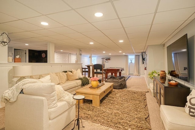 carpeted living room with billiards and a drop ceiling