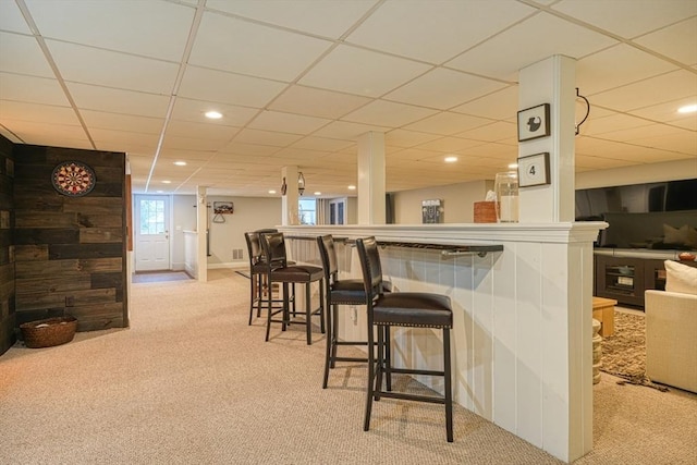 bar featuring light colored carpet