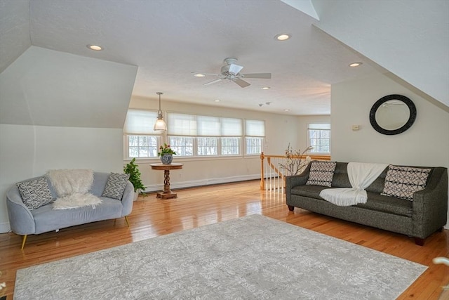 living room with hardwood / wood-style flooring and ceiling fan