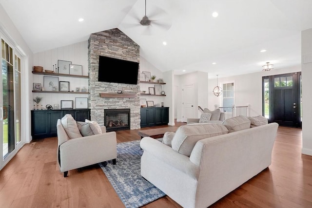 2 Turning Leaf Rd, Ludlow, MA 01056 - living room with a ceiling fan, light wood finished floors, a stone fireplace, and high vaulted ceiling
