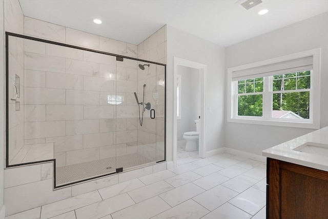 2 Turning Leaf Rd, Ludlow, MA 01056 - bathroom featuring baseboards, toilet, vanity, marble look tile flooring, and a shower stall