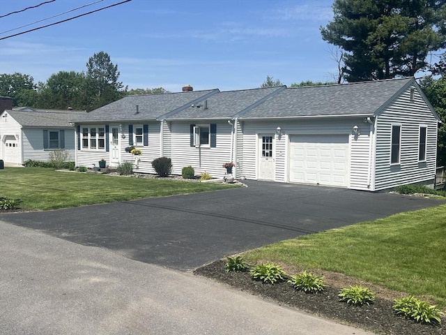 40 Flaggler Rd, Leominster, MA 01453 - ranch-style home with an attached garage, asphalt driveway, roof with shingles, a front lawn, and a chimney