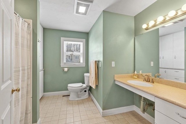 40 Flaggler Rd, Leominster, MA 01453 - bathroom with a sink, toilet, tile patterned floors, and baseboards