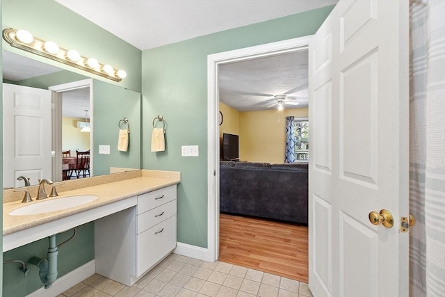 40 Flaggler Rd, Leominster, MA 01453 - ensuite bathroom with tile patterned flooring, baseboards, a ceiling fan, and vanity