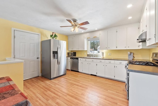 40 Flaggler Rd, Leominster, MA 01453 - kitchen featuring stainless steel appliances, ceiling fan, light wood-type flooring, a sink, and white cabinetry