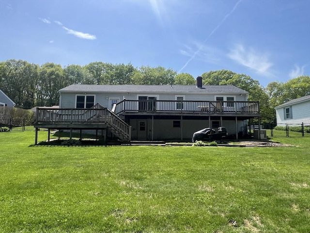 40 Flaggler Rd, Leominster, MA 01453 - back of property featuring a wooden deck, stairs, and a chimney