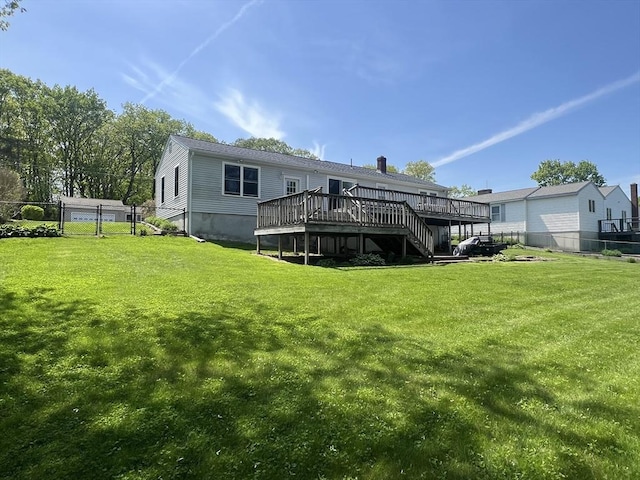 40 Flaggler Rd, Leominster, MA 01453 - rear view of property featuring a wooden deck, stairway, and a chimney