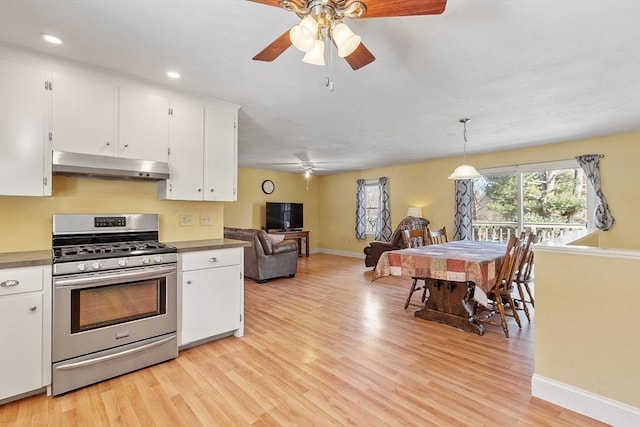 40 Flaggler Rd, Leominster, MA 01453 - kitchen with stainless steel gas range, under cabinet range hood, ceiling fan, white cabinetry, and recessed lighting
