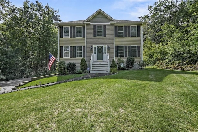 colonial home with a front lawn