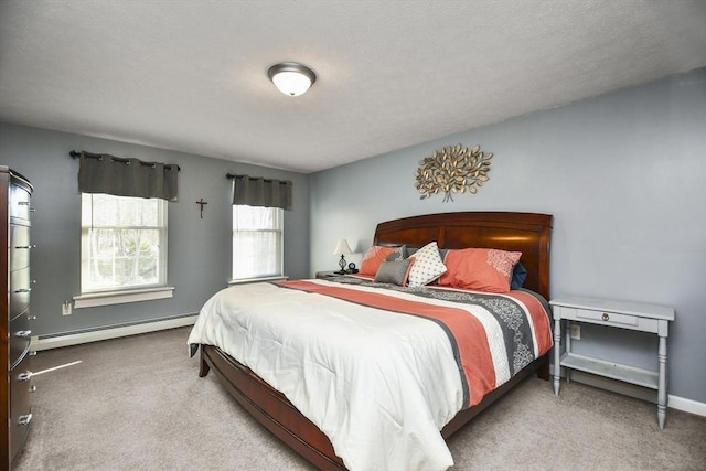 carpeted bedroom with a baseboard heating unit