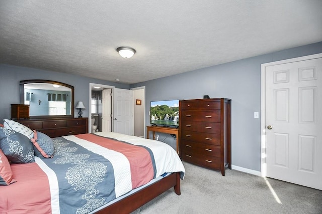 carpeted bedroom with a textured ceiling