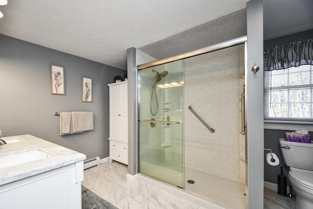 bathroom with a baseboard radiator, toilet, vanity, and walk in shower