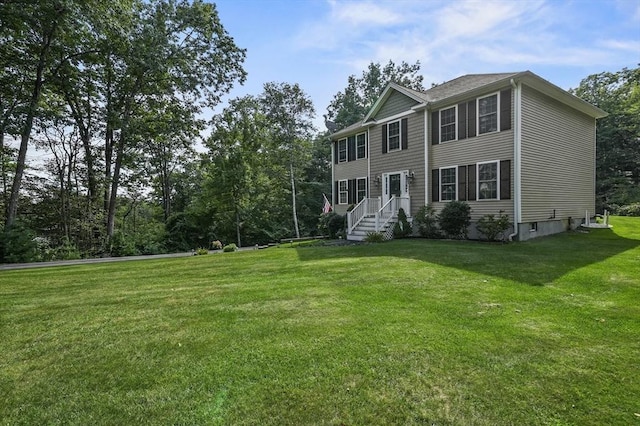 colonial-style house with a front lawn