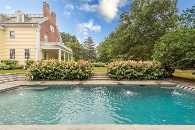 view of pool featuring pool water feature