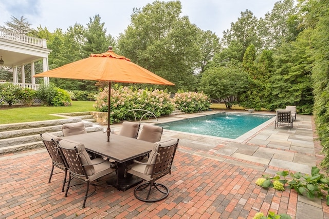 view of swimming pool featuring a patio, a yard, and pool water feature