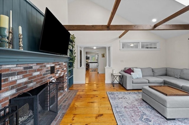 44 Prospect Rd, Plympton, MA 02367 - living area with light wood-style flooring, a brick fireplace, and decorative columns