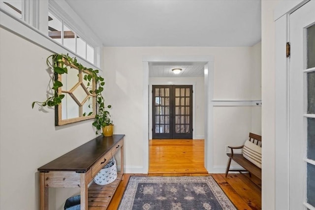 44 Prospect Rd, Plympton, MA 02367 - doorway to outside featuring wood finished floors, french doors, and baseboards