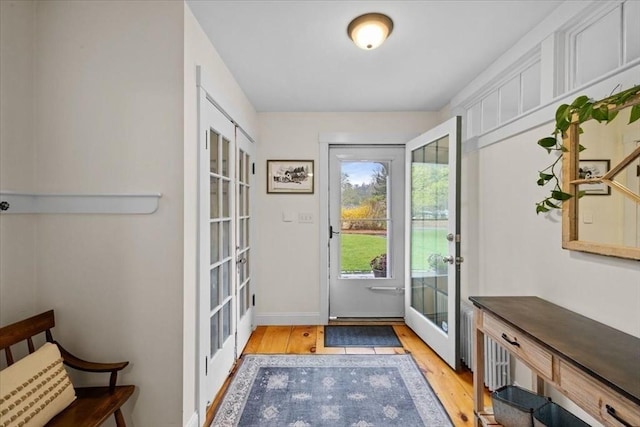 44 Prospect Rd, Plympton, MA 02367 - doorway with french doors, light wood finished floors, and baseboards