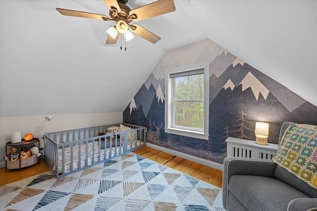44 Prospect Rd, Plympton, MA 02367 - bedroom with wood finished floors, wallpapered walls, baseboards, ceiling fan, and vaulted ceiling