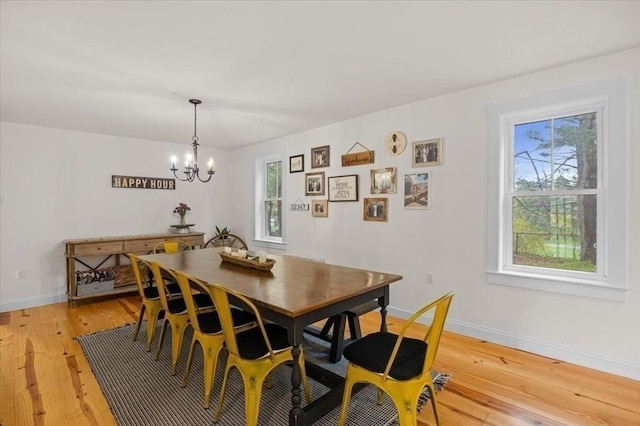 44 Prospect Rd, Plympton, MA 02367 - dining area with a chandelier, light wood finished floors, and baseboards