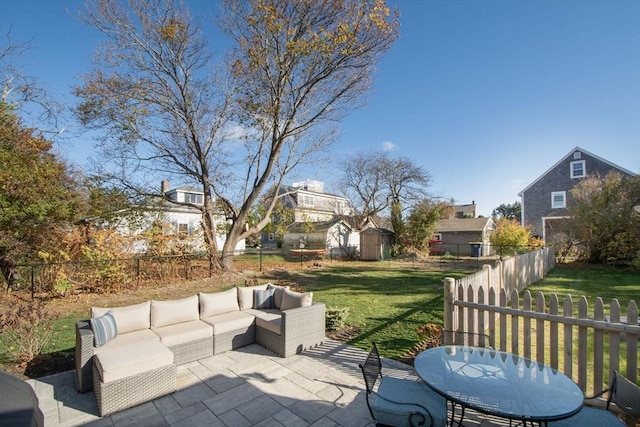 view of patio / terrace with a shed and outdoor lounge area