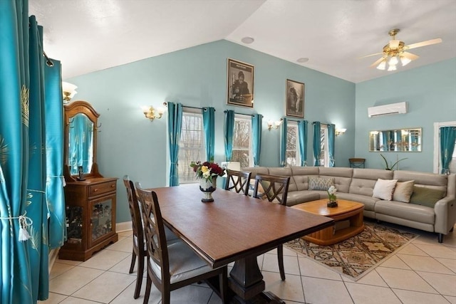 tiled dining room featuring ceiling fan, vaulted ceiling, and a wall unit AC