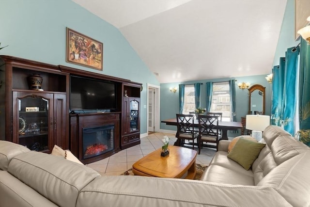 living room featuring lofted ceiling and light tile patterned floors