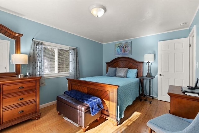 bedroom with light wood-type flooring