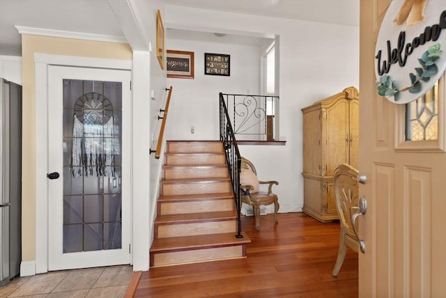 foyer entrance with light hardwood / wood-style flooring