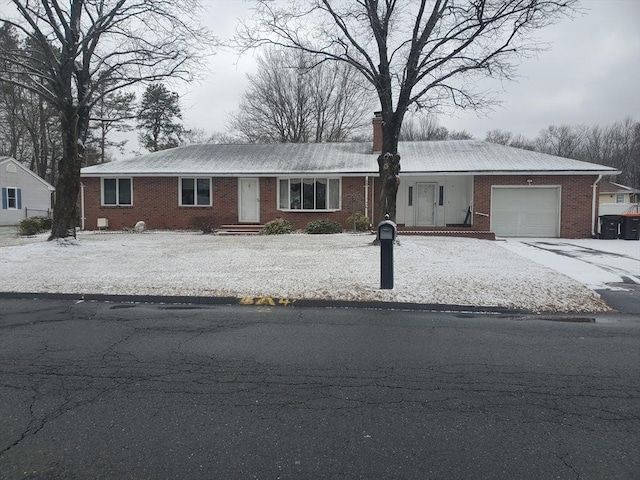 single story home with a garage