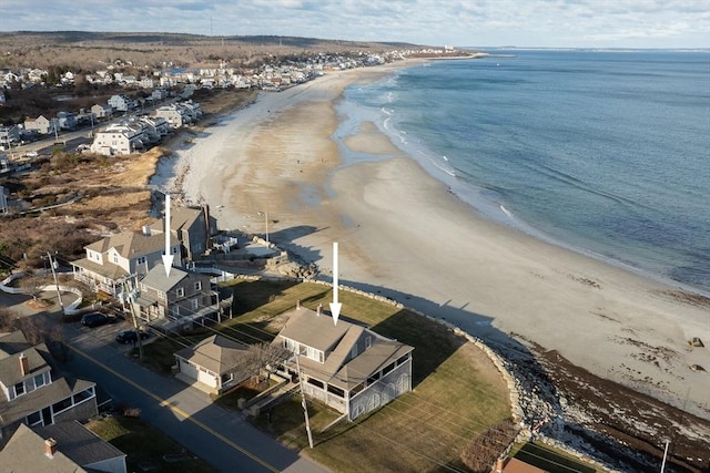 bird's eye view with a water view and a beach view