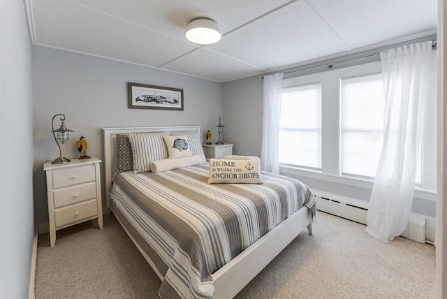 carpeted bedroom featuring a baseboard radiator