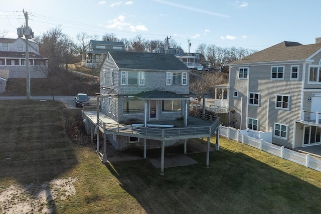 back of house with a yard and a wooden deck