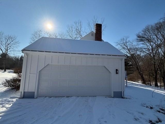 view of snow covered garage