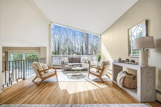 sunroom / solarium with a baseboard heating unit