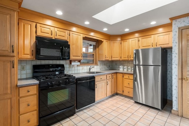 50 Thompson St, Dedham, MA 02026 - kitchen featuring black appliances, a sink, a skylight, light brown cabinetry, and wallpapered walls