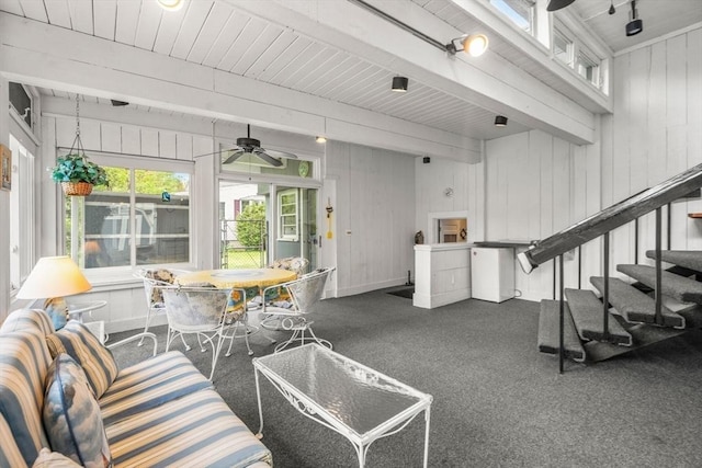 50 Thompson St, Dedham, MA 02026 - living area featuring ceiling fan, beam ceiling, baseboards, and wood walls