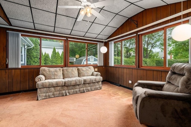 50 Thompson St, Dedham, MA 02026 - living area with carpet floors, healthy amount of natural light, wood walls, a ceiling fan, and lofted ceiling