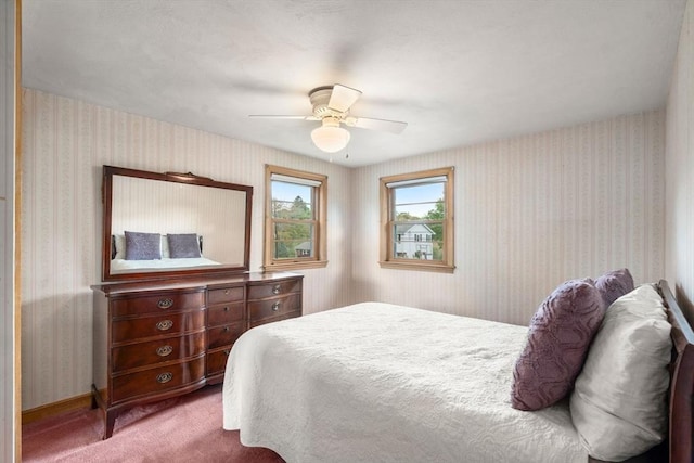50 Thompson St, Dedham, MA 02026 - carpeted bedroom with wallpapered walls and a ceiling fan