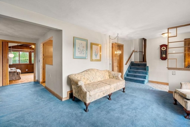 50 Thompson St, Dedham, MA 02026 - carpeted living area with stairway, baseboards, and a chandelier