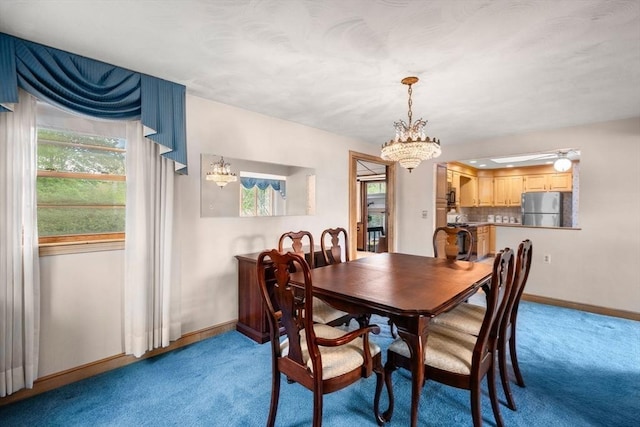 50 Thompson St, Dedham, MA 02026 - dining room featuring a chandelier, light colored carpet, and baseboards
