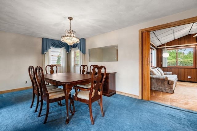 50 Thompson St, Dedham, MA 02026 - carpeted dining space with a chandelier, lofted ceiling, healthy amount of natural light, baseboards, and wooden walls