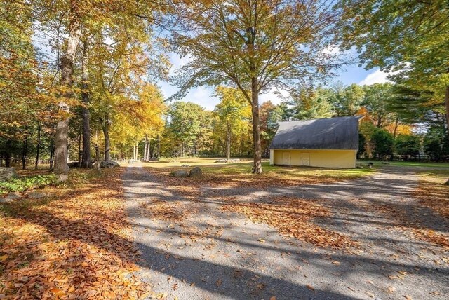 view of road with driveway